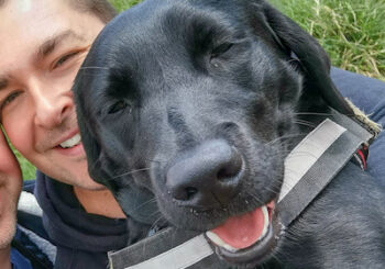 Adam Smalley and Betty, the Labrador